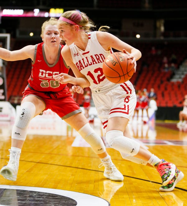 Ballard's Meg Reitz drives to the basket during the 4A semifinals game against Dallas Center Grimes Thursday, March 4, 2021.