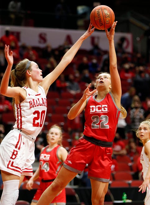 Julia Reis of Dallas Center Grimes puts up a shot as Cassidy Thompson of Ballard defends during the 4A semifinals game Thursday, March 4, 2021.